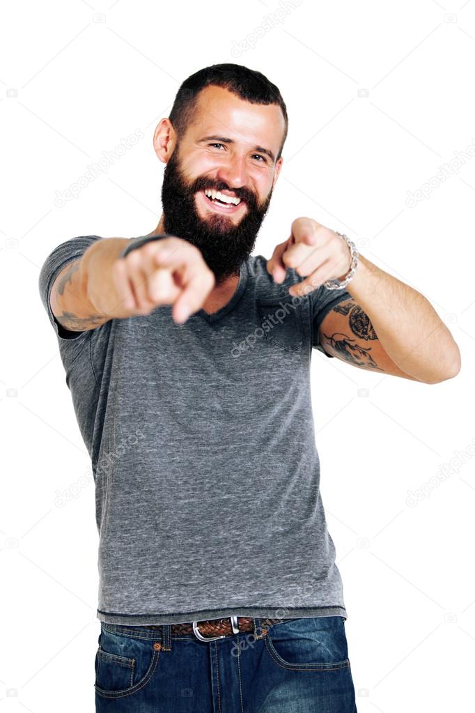 Tattooed bearded man pointing at you