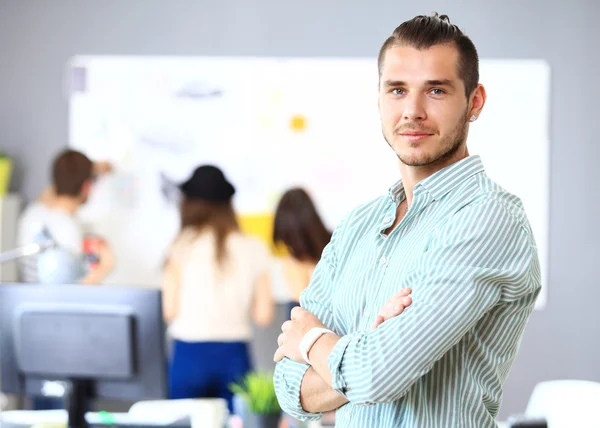 Smart young businessman with folded hands — Stok fotoğraf