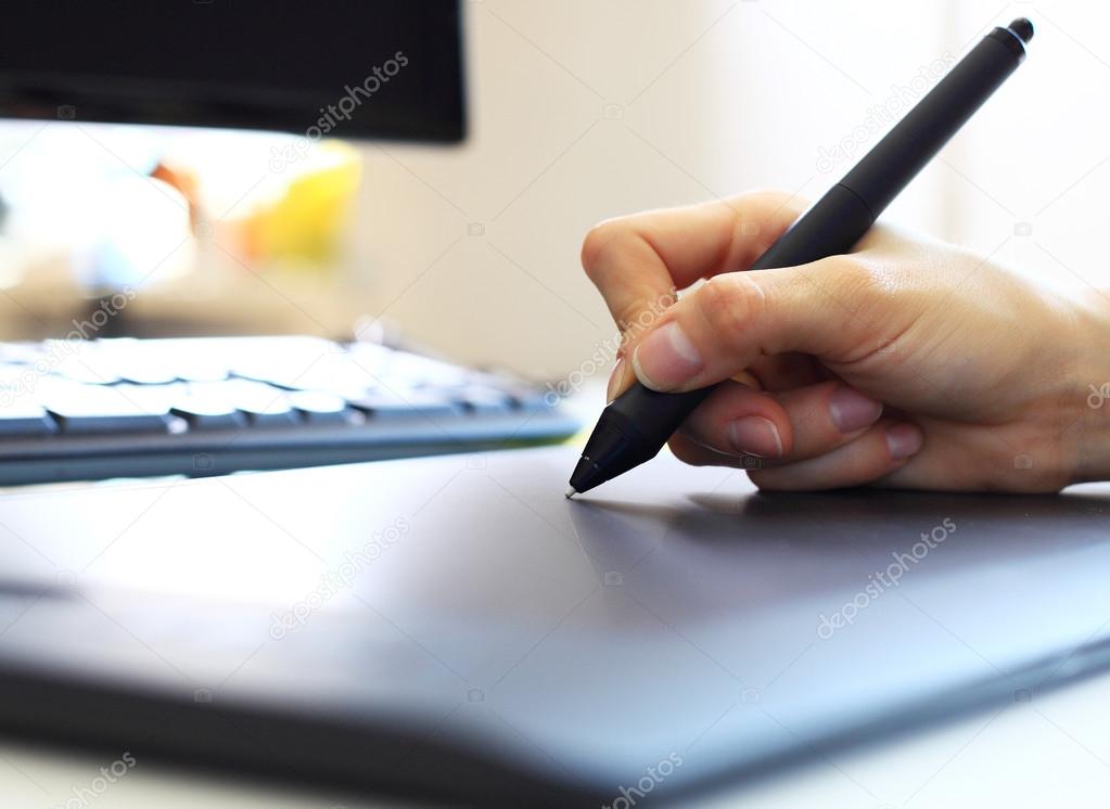 Graphic designer using digital tablet