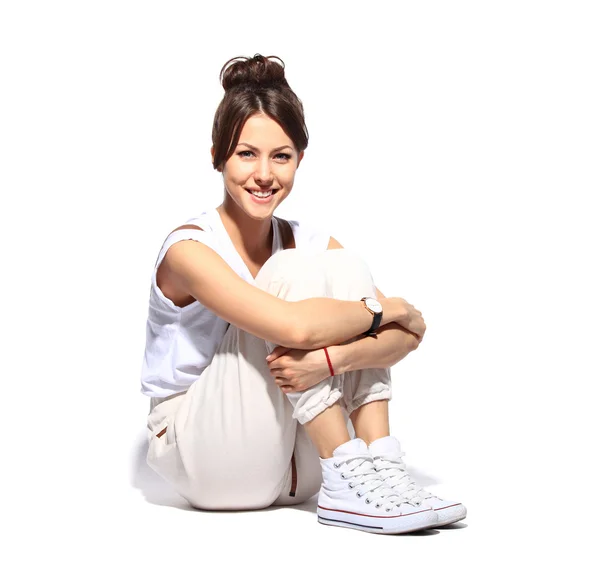 Casual woman smiling sitting on  floor — Stok fotoğraf