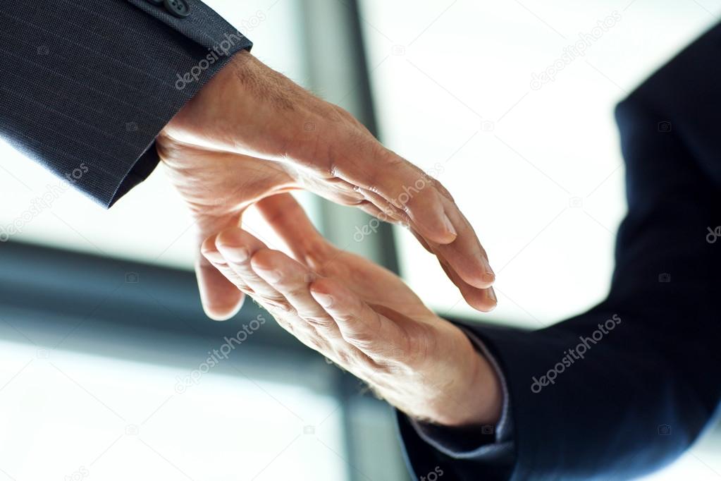businessmen handshake close up