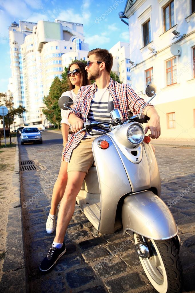 young couple on scooter