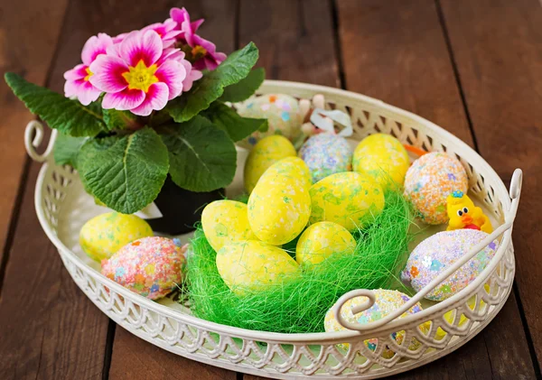 Easter eggs and flowers — Stock Photo, Image