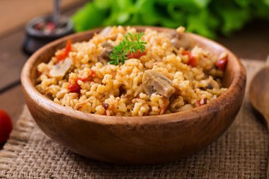 Bulgur with chicken, mushrooms and tomatoes clipart