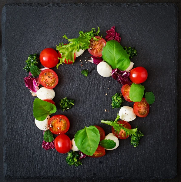 Caprese salad tomato and mozzarella with basil — Stock Photo, Image