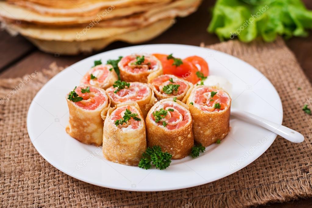 Appetizing pancakes with salmon