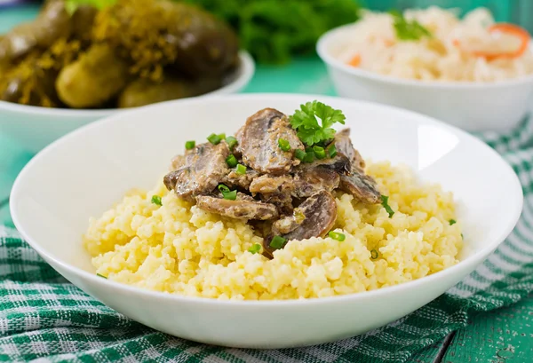 Millet porridge with mushrooms — Stock Photo, Image