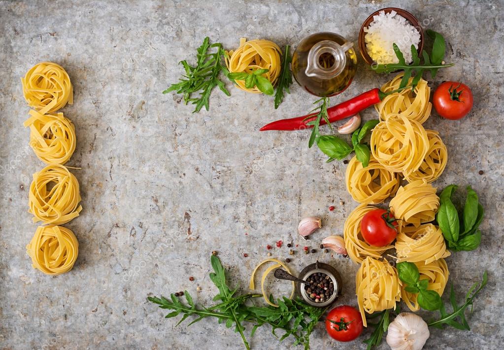 Pasta Tagliatelle nests and ingredients — Stock Photo © timolina 113261340
