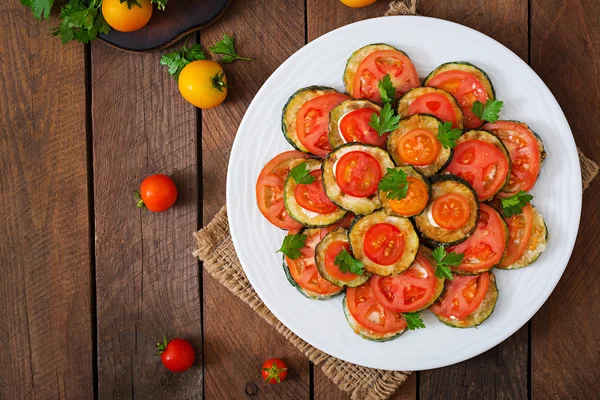 Snack of fried zucchini with tomatoes — Stock Photo, Image