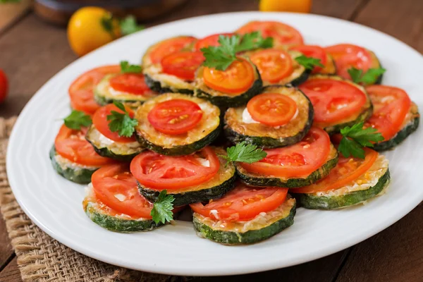 Snack of fried zucchini with tomatoes — Stock Photo, Image