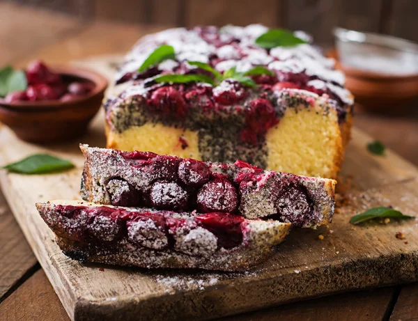 Cherry cake with poppy seeds — Stock Photo, Image