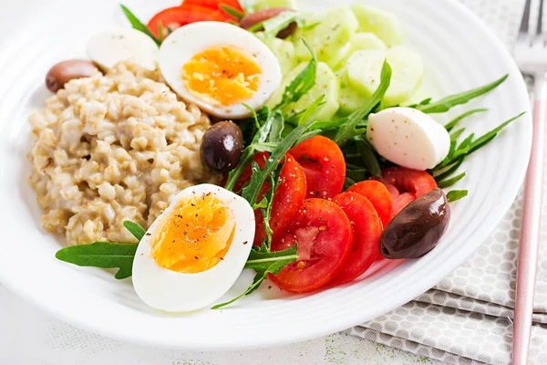 Breakfast Oatmeal Porridge Greek Salad Tomatoes Cucumbers Olives Eggs Healthy — Stock Photo, Image