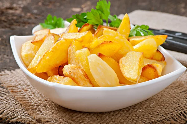 Cunhas de batata fritas — Fotografia de Stock