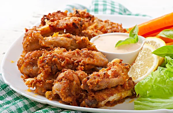 Chicken wings with parmesan cheese — Stock Photo, Image