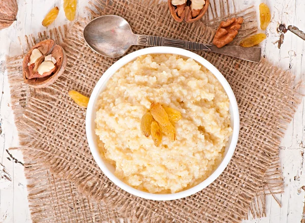 Porridge  with nuts and raisins — Stock Photo, Image