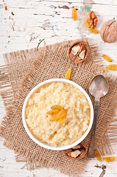 Porridge  with nuts and raisins — Stock Photo, Image