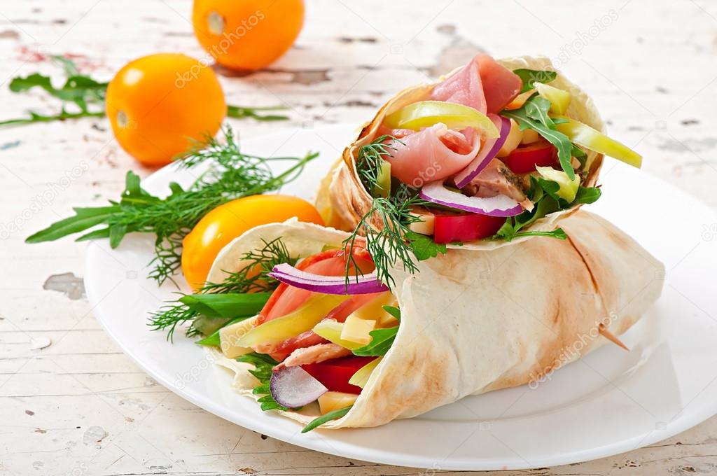 Fresh tortilla wraps with meat and vegetables