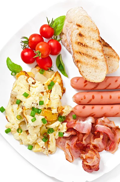 Scrambled eggs, bacon, sausage and toast — Stock Photo, Image