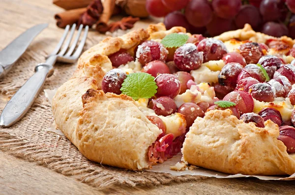 Galette with grapes and cheese — Stock Photo, Image