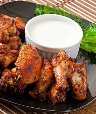 Baked chicken wings in the Asian style clipart