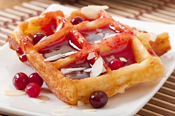 Waffles with cranberry syrup — Stock Photo, Image