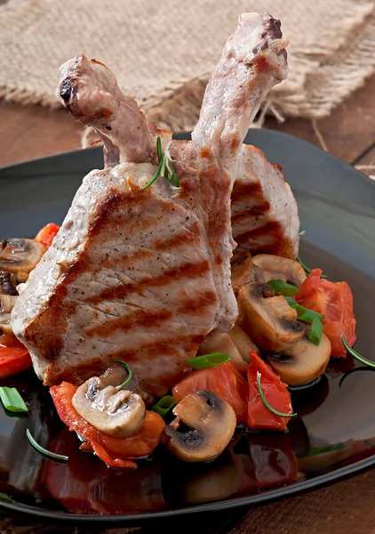 Juicy grilled pork steaks on the bone — Stock Photo, Image