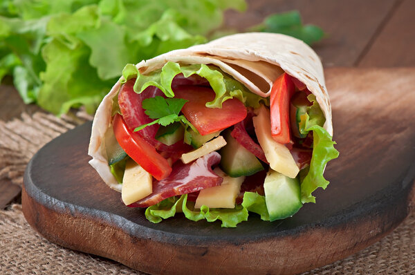 Fresh tortilla wraps with meat and vegetables