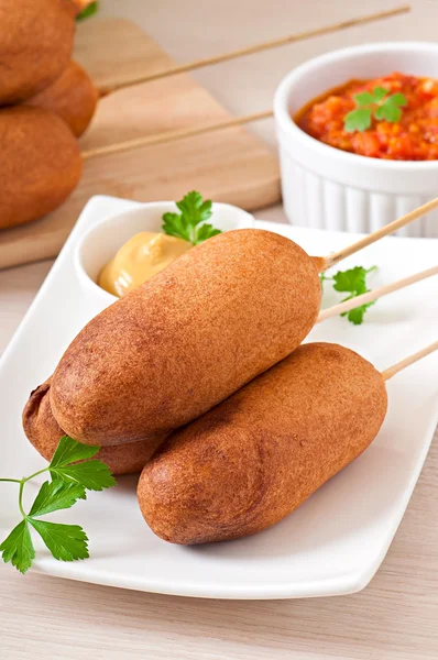 Homemade corn dogs with sauces — Stock Photo, Image