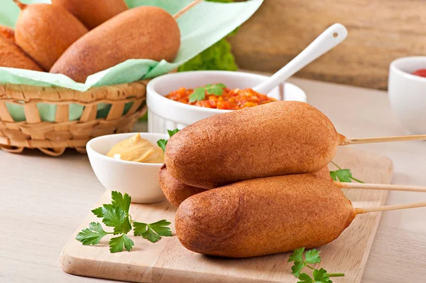 Homemade corn dogs with sauces — Stock Photo, Image