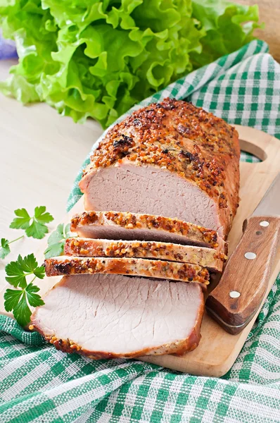 Cut pieces of baked meat on the table — Stock Photo, Image