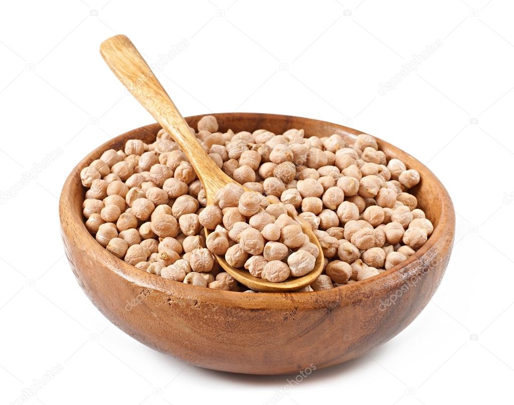 Uncooked chickpeas in wooden bowl