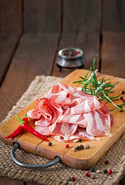 Slices of bacon  with spices — Stock Photo, Image