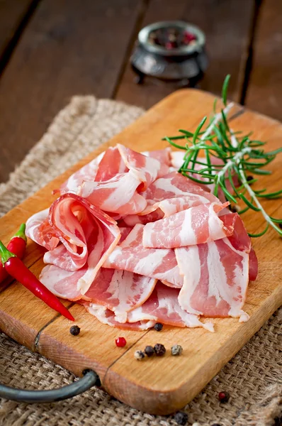 Slices of bacon  with spices — Stock Photo, Image