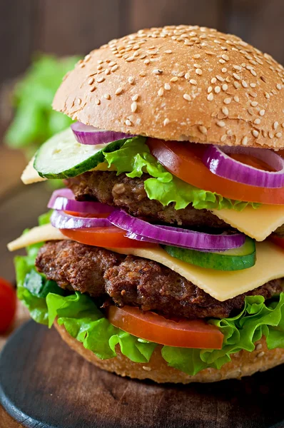 Large burger with meat and vegetables — Stock Photo, Image