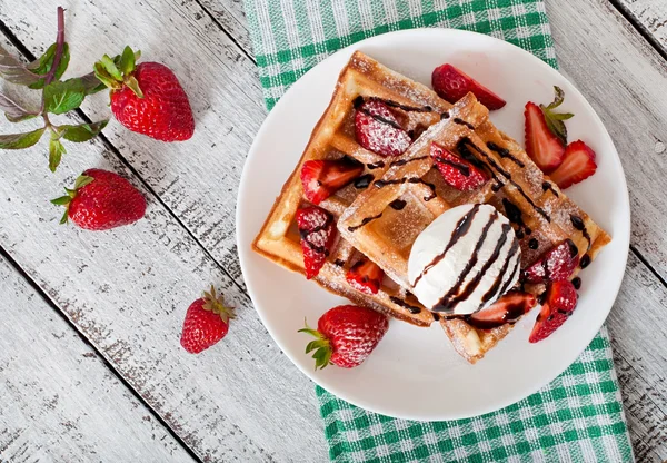 waffles with  strawberries and ice cream