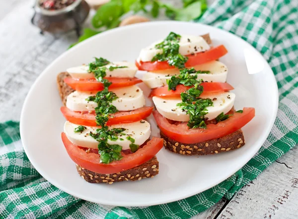Sandwiches with mozzarella, tomatoes — Stock Photo, Image