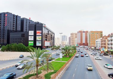 AJMAN, UAE - FEBRUARY 24: Modern Avenue in Ajman, Ajman, United Arab Emirates. February 24, 2015 in Ajman, UAE. clipart