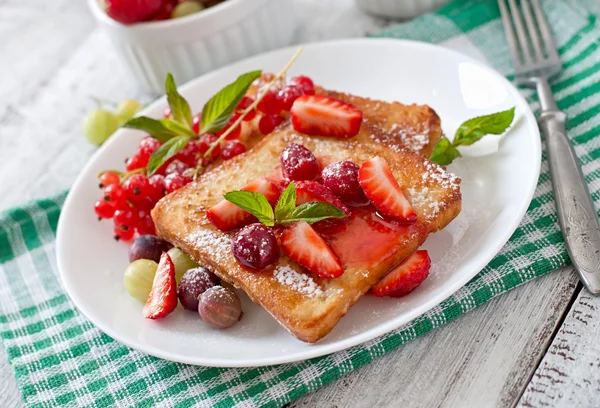 Toasts with berries and jam — Stock Photo, Image
