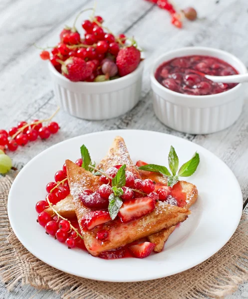 Toasts with berries and jam — Stock Photo, Image