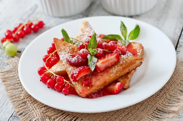 Toasts with berries and jam — Stock Photo, Image