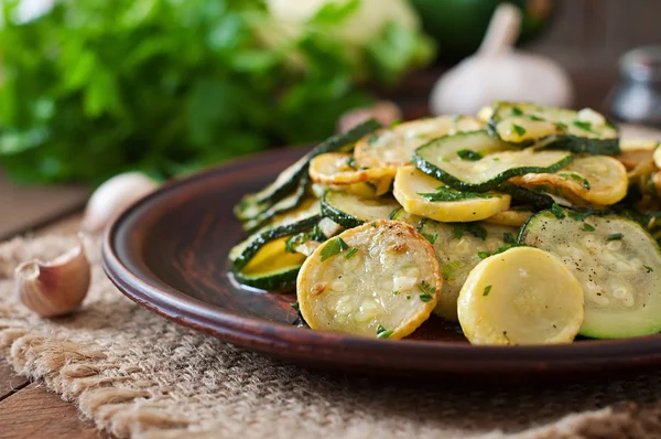 Zucchini with garlic and herbs — Stock Photo, Image