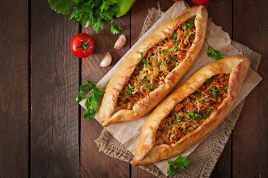 Turkish pides with beef and vegetables clipart