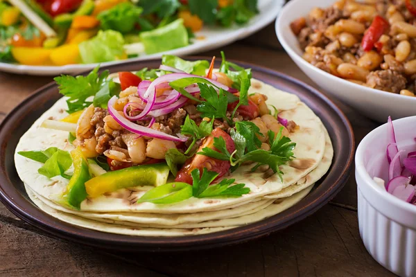 Mexican tacos with meat, beans and salsa — Stock Photo, Image