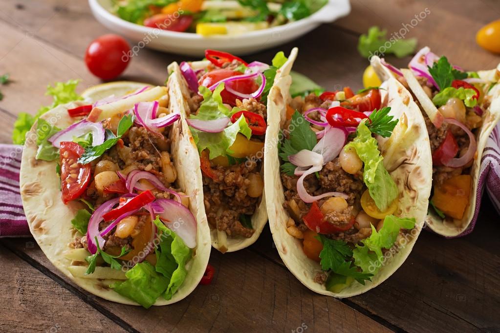 Mexican tacos with meat, beans and salsa Stock Photo by ©timolina 82644144