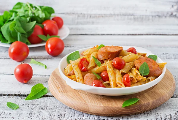 Penne pasta with tomato sauce with sausage — Stock Image Penne pasta with tomato sauce with sausage Stock Image