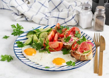 Breakfast Plate with Fried Eggs and Bruschetta