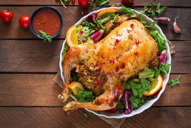 Baked chicken stuffed with rice for Christmas dinner clipart