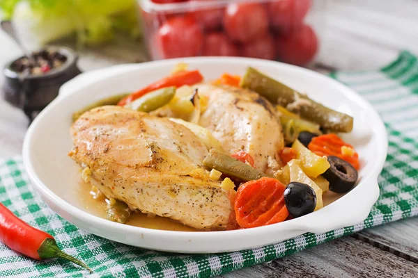 Baked, diet and healthy a chicken fillet with vegetables Royalty Free Stock Images