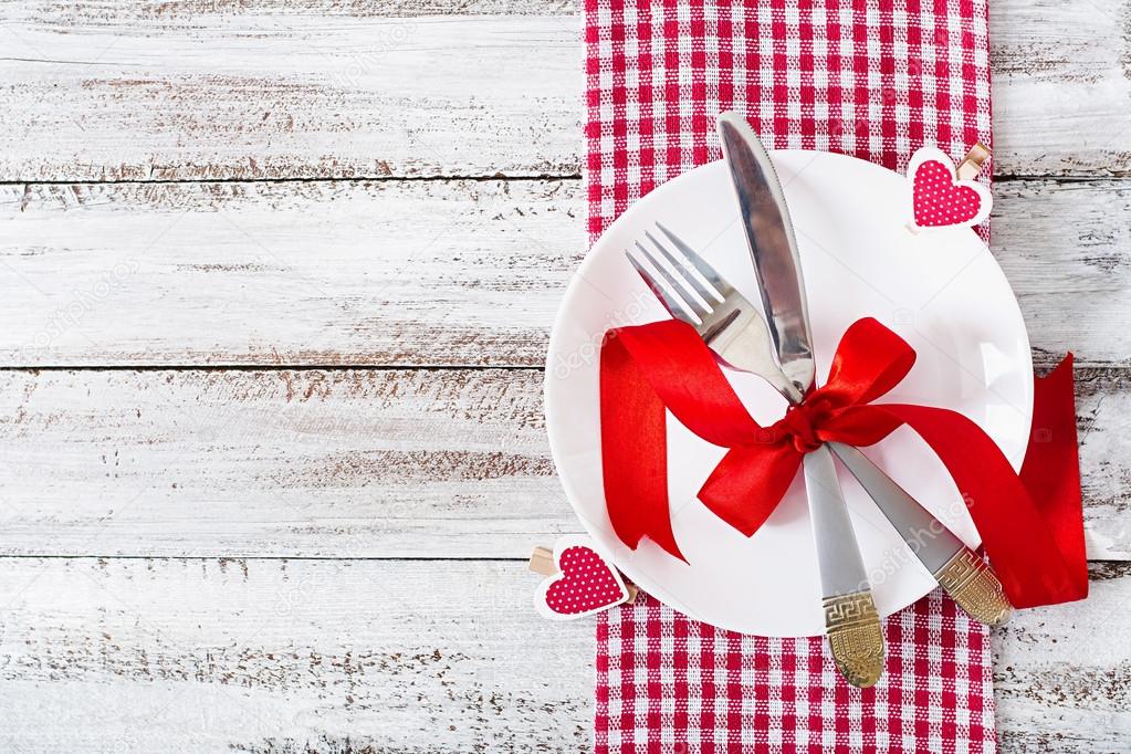 Romantic table setting for Valentines day in a rustic style.