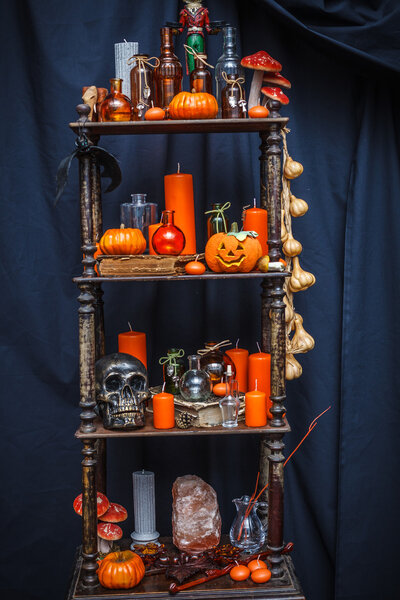 Old shelves with items to celebrate halloween